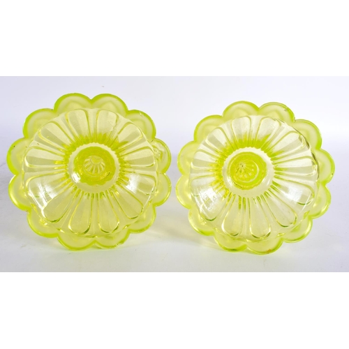 63 - A PAIR OF ART DECO URANIUM GLASS CANDLESTICKS. 24 cm high.