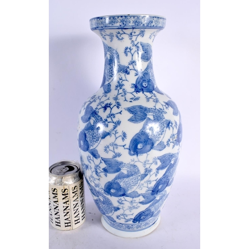 64 - A CHINESE REPUBLICAN PERIOD BLUE AND WHITE PORCELAIN VASE decorated with carp. 35 cm high.