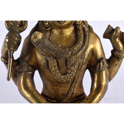 646 - A 19TH CENTURY INDIAN BRONZE HINDU FIGURE OF SHIVA  modelled seated on a lion skin with vasuki, king... 