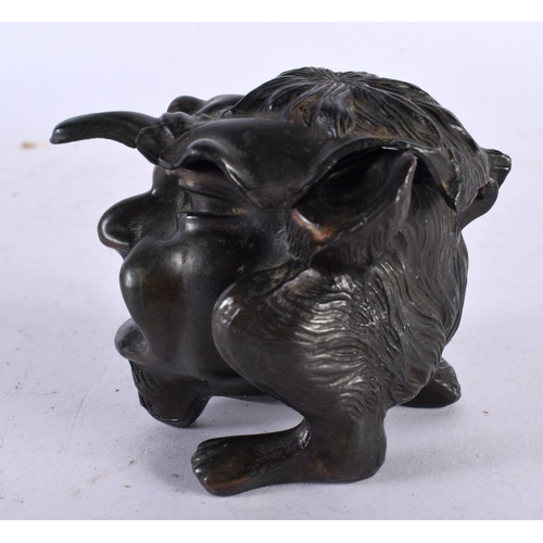 648 - A SMALL 19TH CENTURY CONTINENTAL INKWELL AND COVER possibly bronze, formed as a grotesque mask head.... 