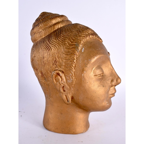 65 - A STUDIO POTTERY GOLD LACQUERED POTTERY BUST OF A BUDDHA. 22cm x 10 cm.