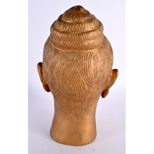 65 - A STUDIO POTTERY GOLD LACQUERED POTTERY BUST OF A BUDDHA. 22cm x 10 cm.