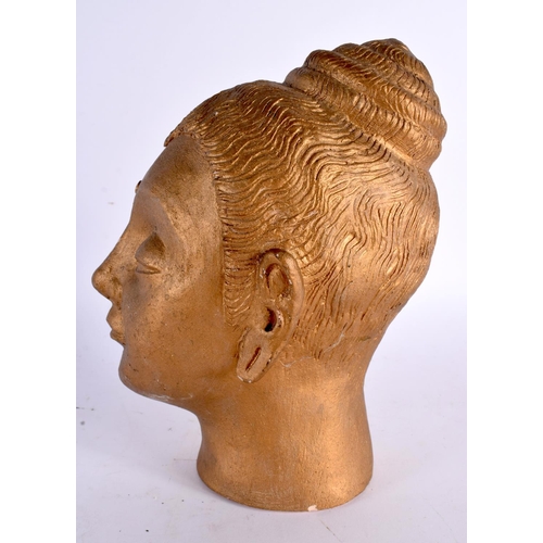 65 - A STUDIO POTTERY GOLD LACQUERED POTTERY BUST OF A BUDDHA. 22cm x 10 cm.