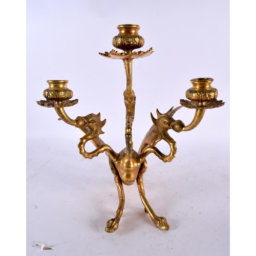 652 - A 19TH CENTURY GILT BRONZE CANDELABRA in the form of a three headed griffin with wings of a phoenix,... 