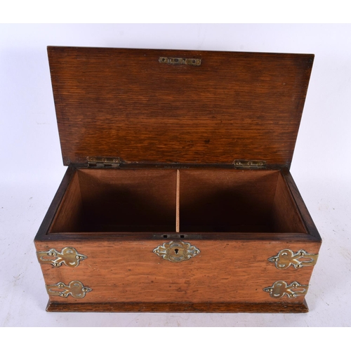 654 - A VICTORIAN BRASS MOUNTED OAK CIGAR BOX with two compartments, Rg Design 100157 C1888. 28cm x 12 cm.