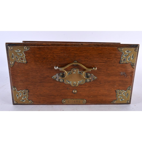 654 - A VICTORIAN BRASS MOUNTED OAK CIGAR BOX with two compartments, Rg Design 100157 C1888. 28cm x 12 cm.