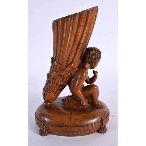 658 - A FINE 18TH CENTURY CONTINENTAL CARVED FRUITWOOD SPILL VASE modelled as a nude male kneeling with a ... 