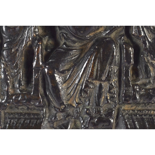 661 - A 17TH/18TH CENTURY EUROPEAN BRONZE PANEL OF A FEMALE SAINT modelled amongst other figures and build... 