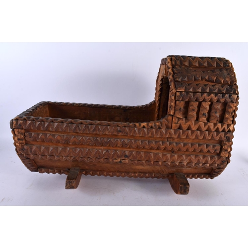 662 - A VERY UNUSUAL TRAMP ART CARVED WOOD MODEL OF A CRIB. 42 cm x 30cm.