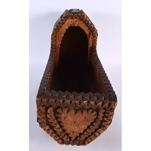 662 - A VERY UNUSUAL TRAMP ART CARVED WOOD MODEL OF A CRIB. 42 cm x 30cm.