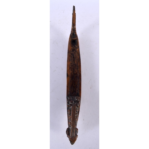 664 - A NEW ZEALAND TRIBAL WAKA TAUA WAR CANOE by Allan Davey & Company. 34 cm long.