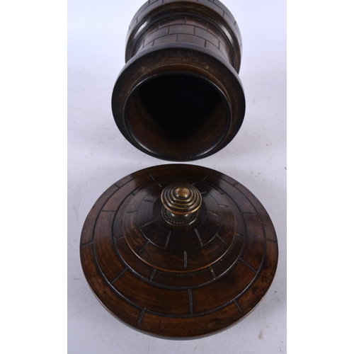 669 - AN UNUSUAL 19TH CENTURY TREEN CASTLE TURRET TEA CADDY AND COVER. 15cm x 8 cm.