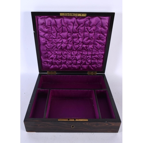 671 - AN EARLY VICTORIAN CARVED COROMANDEL COUNTRY HOUSE JEWELLERY BOX with bronze mounts. 28cm x 22cm.