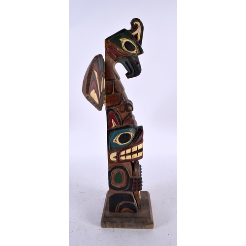 678 - A NORTH AMERICAN CANADIAN INUIT MARLIN NORTHWEST COAST TOTEM by Marlin Alphonse. 32 cm x 24 cm.