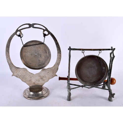 679 - AN AESTHETIC MOVEMENT BRONZE TABLE GONG together with an Indian white white elephant gong. Largest 3... 