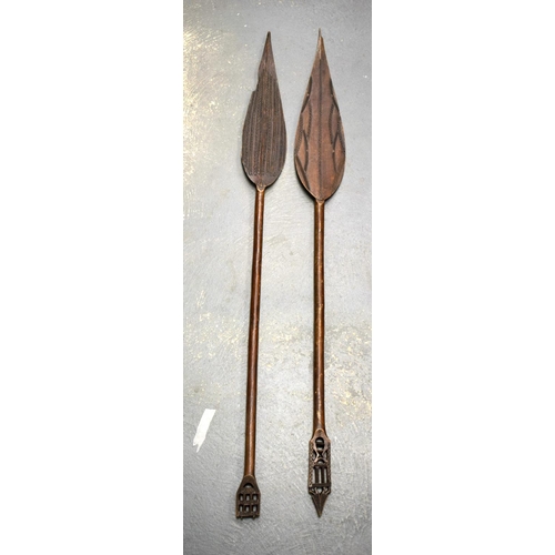 685 - TWO AFRICAN TRIBAL CARVED WOOD PADDLES one decorated with animals, the other with motifs. 160 cm lon... 