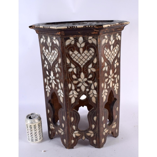 687 - A 19TH CENTURY MIDDLE EASTERN MOTHER OF PEARL INLAID TABLE with bone decoration to the sies. 48 cm x... 