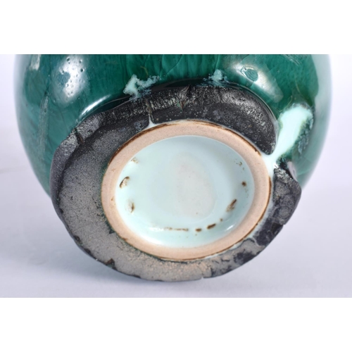 69 - A STUDIO POTTERY HIGH FIRED PORCELAIN GREEN GLAZED VASE. 15cm high.