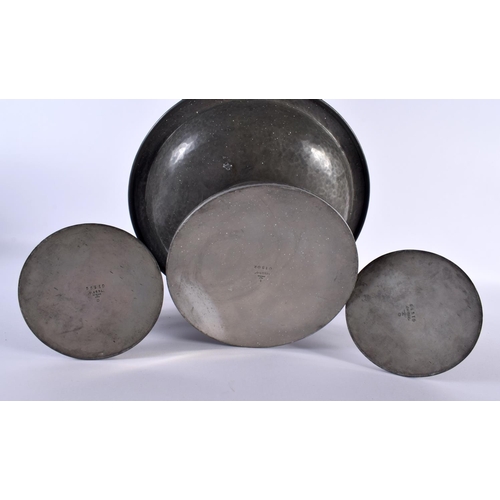 696 - AN ART DECO TUDRIC PEWTER HAMMERED COMPORT together with a matching pair of candlesticks. Largest 24... 