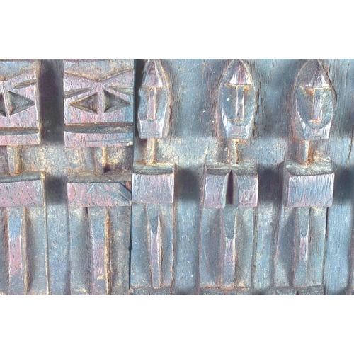 697 - AN AFRICAN TRIBAL CARVED WOOD DOGON DOOR depicting figures and animals. 52 cm x 38 cm.