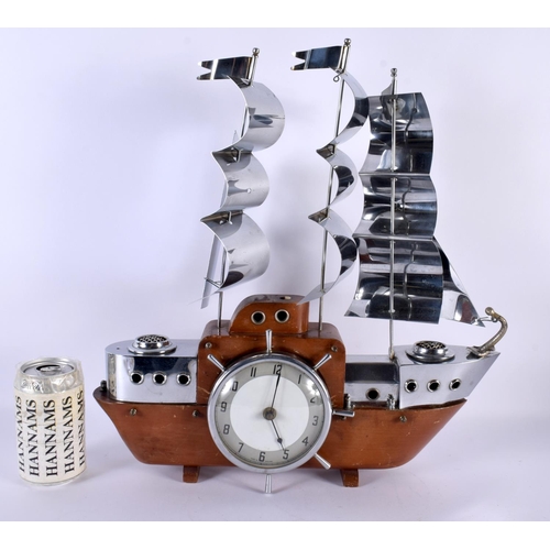 699 - A 1950S RETRO CHROME MARITIME SAILING BOAT MANTEL CLOCK with ships wheel dial. 44 cm x 32 cm.