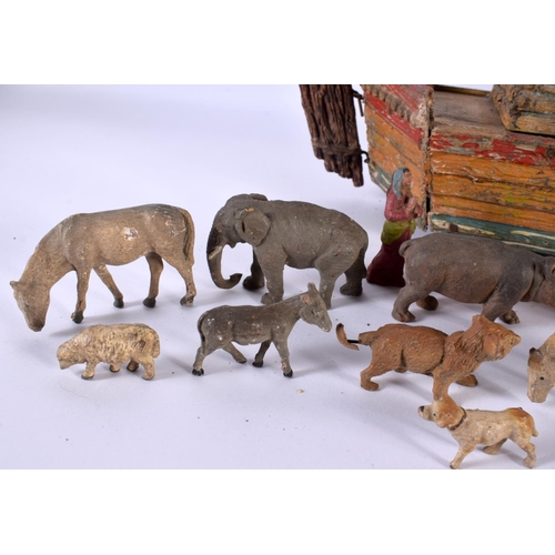 700 - AN EARLY 20TH CENTURY FOLK ART CARVED AND PAINTED WOOD NOAH'S ARK together with toys. Largest 40 cm ... 