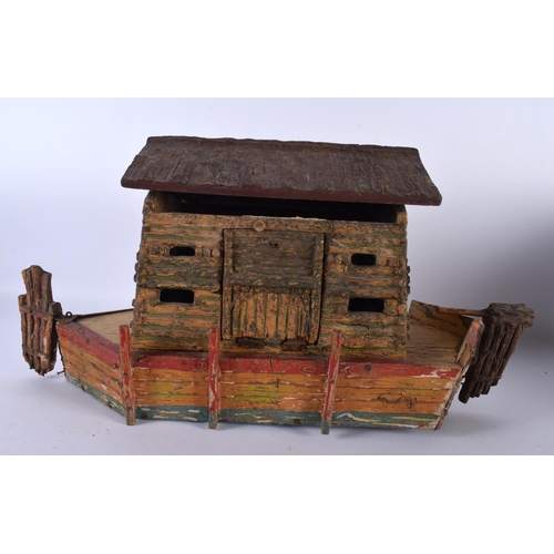 700 - AN EARLY 20TH CENTURY FOLK ART CARVED AND PAINTED WOOD NOAH'S ARK together with toys. Largest 40 cm ... 