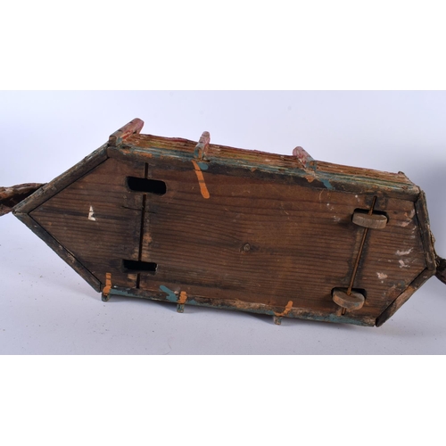 700 - AN EARLY 20TH CENTURY FOLK ART CARVED AND PAINTED WOOD NOAH'S ARK together with toys. Largest 40 cm ... 