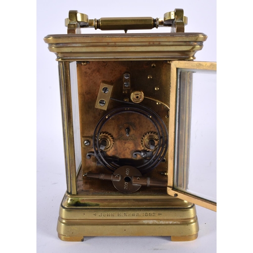 707 - AN ANTIQUE REPEATING BRASS CARRIAGE CLOCK. 18.5 cm high inc handle.