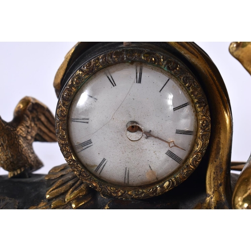 714 - AN EARLY 19TH CENTURY FRENCH GILT BRONZE MOUNTED CLOCK modelled as a puttu beside a bird. 15cm x 12 ... 