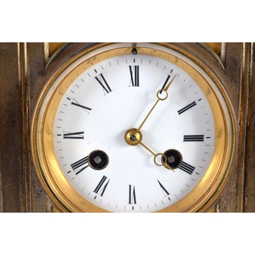 716 - A 19TH CENTURY FRENCH BRONZE MANTEL CLOCK with circular enamel dial. 27 cm x 14cm.