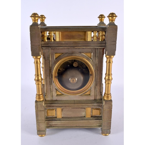 716 - A 19TH CENTURY FRENCH BRONZE MANTEL CLOCK with circular enamel dial. 27 cm x 14cm.