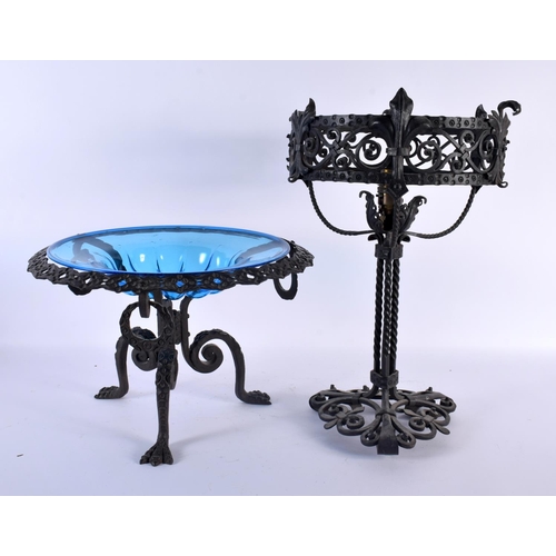 719 - A LARGE ARTS AND CRAFTS IRON LANTERN together with a similar pedestal comport. Largest 42 cm x 22cm.... 