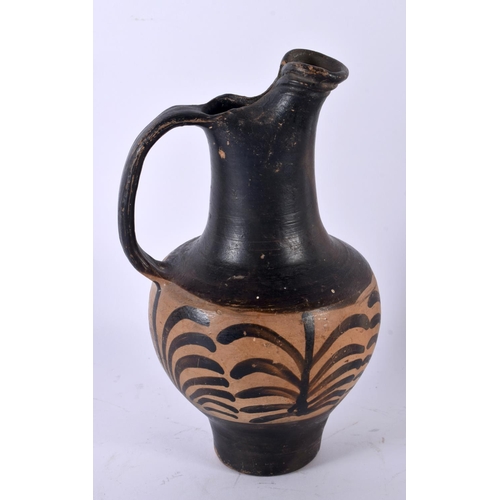 724 - A 4TH CENTURY BC GREEK GNATHIAN POTTERY WINE JUG. 23 cm high.