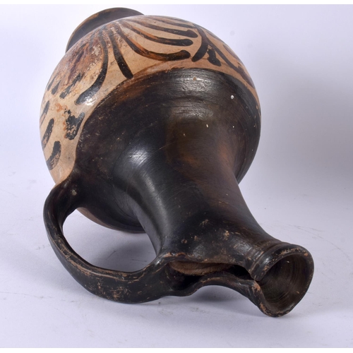 724 - A 4TH CENTURY BC GREEK GNATHIAN POTTERY WINE JUG. 23 cm high.