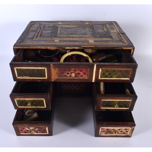 725 - A 17TH/18TH CENTURY PERSIAN MIDDLE EASTERN TORTOISESHELL TABLE CABINET inlaid with bone. 30cm x 22cm... 