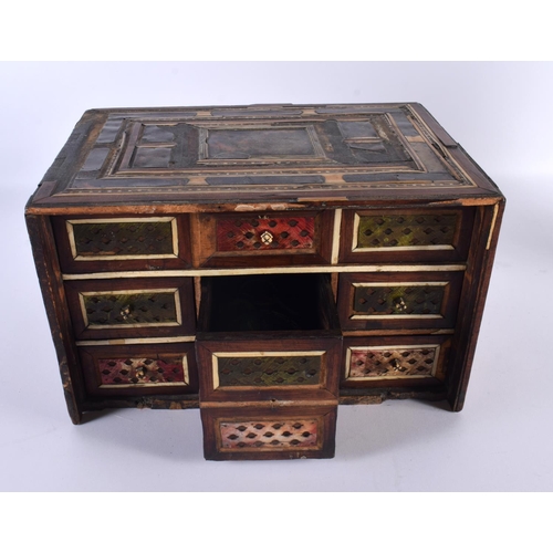 725 - A 17TH/18TH CENTURY PERSIAN MIDDLE EASTERN TORTOISESHELL TABLE CABINET inlaid with bone. 30cm x 22cm... 