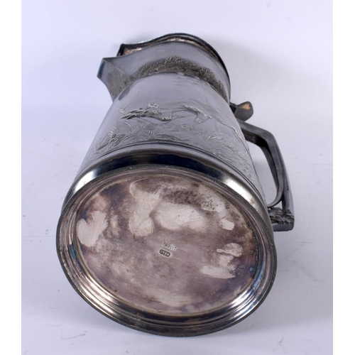 726 - A LARGE EARLY 20TH CENTURY ORIVIT PEWTER TANKARD decorated in relief with hunting scenes. 36 cm high... 