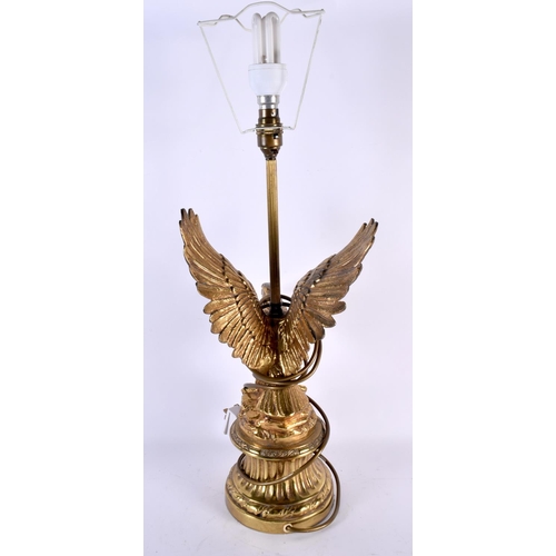 730 - A LARGE EARLY 20TH CENTURY POLISHED BRONZE TABLE LAMP formed as an eagle. 58 cm high.