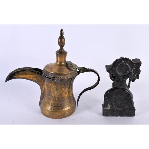 744 - A 19TH CENTURY INDIAN CARVED STONE FIGURE together with a Middle Eastern brass coffee pot. Largest 2... 