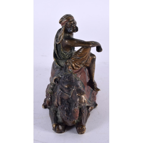 751 - AN 19TH CENTURY AUSTRIAN COLD PAINTED BRONZE ARAB GROUP modelled as a male upon a camel. 14cm x 9 cm... 