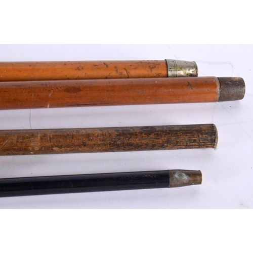 758 - FOUR ANTIQUE SILVER MOUNTED WALKING CANES together a Royal Leicestershire Regiment swagger stick. La... 