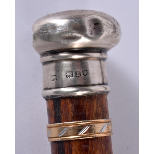 758 - FOUR ANTIQUE SILVER MOUNTED WALKING CANES together a Royal Leicestershire Regiment swagger stick. La... 