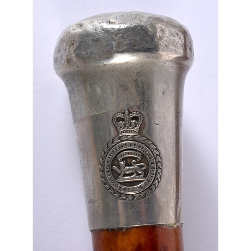 758 - FOUR ANTIQUE SILVER MOUNTED WALKING CANES together a Royal Leicestershire Regiment swagger stick. La... 