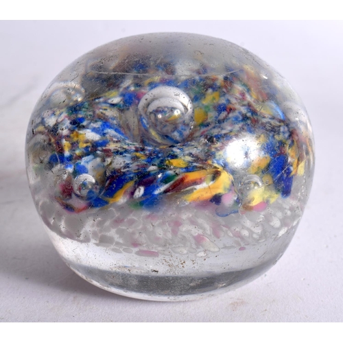 76 - A GLASS PAPERWEIGHT. 7.5 cm wide.