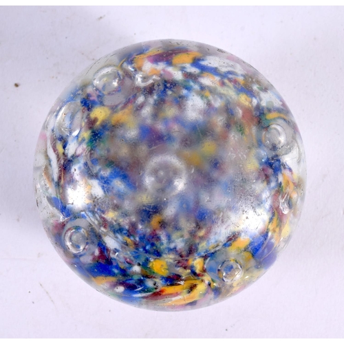 76 - A GLASS PAPERWEIGHT. 7.5 cm wide.