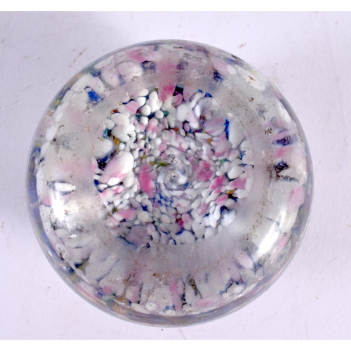 76 - A GLASS PAPERWEIGHT. 7.5 cm wide.