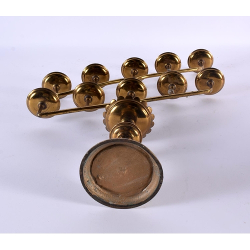 760 - A VINTAGE JEWISH BRASS MENORAH. 46 cm x 28cm.