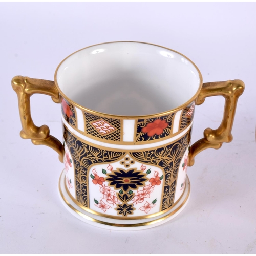 763 - A ROYAL CROWN DERBY CANDLE SNUFFER together with a mug & sucrier. Largest 13 cm wide. (3)