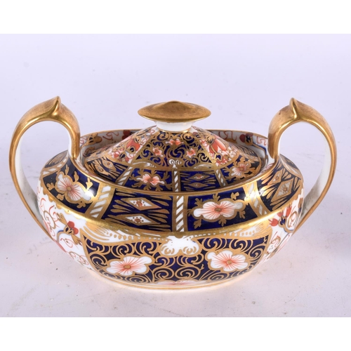 763 - A ROYAL CROWN DERBY CANDLE SNUFFER together with a mug & sucrier. Largest 13 cm wide. (3)